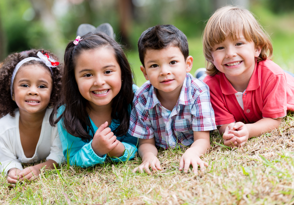 Happy group of kids playing at the park